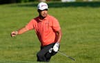 Hideki Matsuyama walks out of a bunker on the 13th hole during the second round of the Memorial 