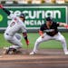 Cleveland’s Andres Gimenez was safe at second after hitting a double before Twins shortstop Kyle Farmer can make a tag Saturday