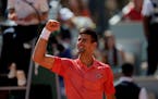 Serbia’s Novak Djokovic celebrates after beating Peru’s Juan Pablo Varillas in their fourth round match of the French Open tennis tournament at th