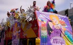 The Hamburger Mary’s Bar & Grille parade entry shows a banner advertising Bud Light beer at the WeHo Pride Parade in West Hollywood, Calif., on Sund