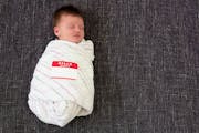credit: Mie Ahmt, iStock Cute baby with “Hello, my name is” name tag on. ORG XMIT: MIN1307161602591158