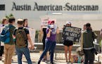 Editorial members of the Austin American-Statesman’s Austin NewsGuild picket along the Congress Avenue bridge in Austin, Texas, Monday, June 5, 2023