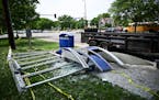 The remains of a bus stop destroyed during a police chase Monday, June 5, 2023, at Olson Memorial Highway and Penn Avenue North in Minneapolis, Minn. 