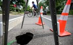 A sinkhole was visible Monday, June 5, at W. 43rd Street and S. Pleasant Avenue in Minneapolis.