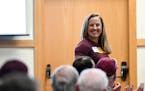 Gophers soccer coach Erin Chastain stood up as she was recognized during the University of Minnesota Coaches Caravan in May 2022.