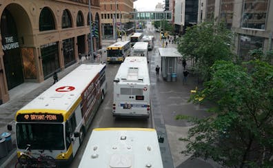 Buses ferried commuters down Nicollet Mall on a Tuesday evening in June 2019.