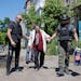 Anna Vasilivana Rudenko, 69, is evacuated from her apartment in Toretsk, in the Donetsk region of eastern Ukraine, by volunteers on Tuesday. The city 