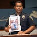 Bloomington Police Chief Booker Hodges, shown last August holding a surveillance photo from the incident.