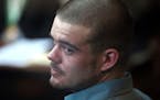 Joran van der Sloot looks back from his seat after entering the courtroom for the continuation of his murder trial at San Pedro prison in Lima, Peru, 
