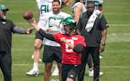 New York Jets quarterback Aaron Rodgers (8) throws during a drill on Tuesday.