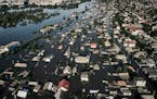 Streets are flooded in Kherson, Ukraine, Wednesday, June 7, 2023 after the walls of the Kakhovka dam collapsed. Residents of southern Ukraine, some wh