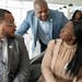 Damon Jenkins (center), the Twin Cities regional market president of First Independence Bank, spoke with Donte Stamps (left) and Charlotte Epee, finan
