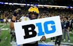 Michigan’s TJ Guy celebrated his team’s Big Ten football championship game victory against Iowa in Indianapolis on Dec. 4, 2021.