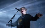 Robert Smith of the Cure reveled in dark tones Thursday at Xcel Energy Center in St. Paul.
