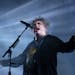 Robert Smith of the Cure reveled in dark tones Thursday at Xcel Energy Center in St. Paul.