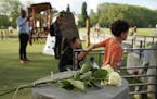 Roses lay at the playground after a knife attack Thursday, June 8, 2023 in Annecy, French Alps. 