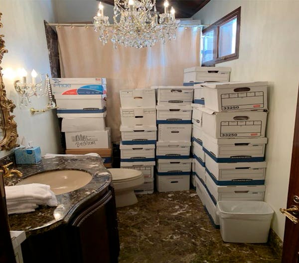 This image, contained in the indictment against former President Donald Trump, shows boxes of records stored in a bathroom and shower in the Lake Room
