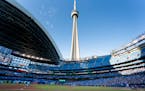 Toronto Blue Jays starting pitcher Ross Stripling throws the opening pitch of the team’s baseball game against the Kansas City Royals on Friday, Jul