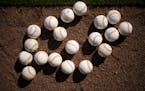 Practice balls in the infield gravel at Hammond Stadium in Fort Myers, Florida Friday, March 18, 2022. Minnesota Twins players not playing in a game a