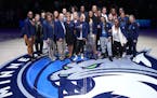 Minnesota Lynx greats stand for a photo on the court during a postgame ceremony with 19 of the top 25 players of the All-25 Team in attendance Friday