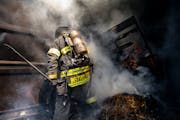 A Lake Superior College instructor moved debris around inside a shipping container that was simulating a residential fire to allow smoke to vent out d