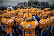 The Esko football team huddled before a game in 2019. The school district will change its “Eskomos” mascot in light of a new state law.
