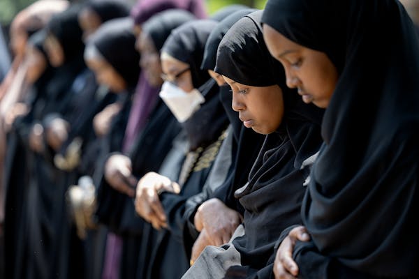 Women lined up in prayer at Dar Al-Farooq Islamic Center in Bloomington on Monday during the funeral for the five young women killed in a car crash on