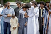 Family members comforted one another Monday at the funeral of the five young women killed in a car crash on Lake Street, at the Garden of Eden Islamic