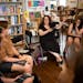 Emily Bergslien, center, leads a science fiction/fantasy book club at Next Chapter Books on Friday, June 30, 2023 in St. Paul. 
