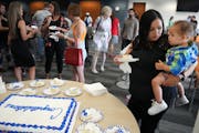 Dani Powe had a piece of cake along with her 19-month-old son Israel after the Hennepin County Treatment Courts graduation ceremony Friday at the Henn