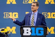 Michigan coach Jim Harbaugh spoke at Big Ten Media Days in Indianapolis in 2021. He’s facing a four-game suspension over statements he made to NCAA 