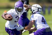 Vikings rookie wide receiver Jordan Addison worked to get past a defender at practice.