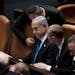 Israel’s Prime Minister Benjamin Netanyahu, center, is surrounded by lawmakers at a session of the Knesset, Israel’s parliament, in Jerusalem, Isr