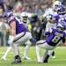 Minnesota Vikings quarterback Kirk Cousins (8) is tripped up by Ed Ingram during a game in December.