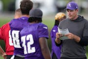 Vikings coach Kevin O’Connell worked with quarterback Kirk Cousins during training camp Saturday at the TCO Performance Center in Eagan.