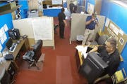 This surveillance video shows members of the Marion Police Department confiscating computers and cellphones from the publisher and staff of the Marion