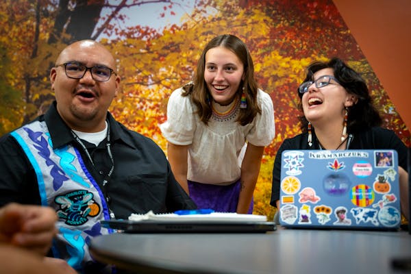 Taylor Fairbanks, middle, one of the Native American Undergraduate Museum Fellows and August Mentch, right, the program support intern, at the Minneso