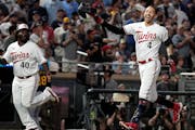 Twins shortstop Carlos Correa (4) celebrated as he rounded the bases after hitting a walk-off home run in the ninth inning against the Brewers at Targ