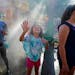 Sisters Sophia, 6, and Danielle Gubash, 10, cooled off in the misters near the Fine Arts building at the State Fair.