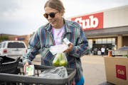 Rebecca Bullers, a graduate student at the University of Minnesota, loaded her car with groceries outside of Cub in Minneapolis this month.