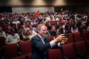 Minnesota Secretary of State Steve Simon takes a selfie with students gathered at an assembly at Albert Lea High School to let 16- and 17-year-olds kn