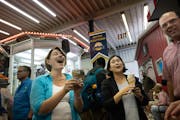 U.S. Sen. Amy Klobuchar and U.S. Trade Rep. Katherine Tai ate ice cream in the Dairy Building at the State Fair on Wednesday.