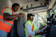 Location safety manager Courtney Smith, left, worked with an experienced driver on procedures for a new bus with new safety technology Thursday in Bro