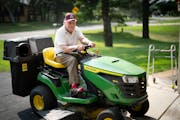 Stan Nelson, at 102, likes to ride his mower, cook and tell stories.
