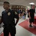 Cortez Hull, then a school resource officer at Highland Park High School in St. Paul, monitored the hallways as classes let out for the day in 2016.