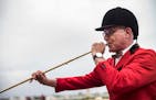 In Shakopee, MN on May 18, 2021, on opening day at Canterbury Park, Lynn Deichert has been playing the bugle before each race for 27 years.] RICHARD T