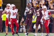 Gophers safety Tyler Nubin (27) celebrated after intercepting Nebraska quarterback Jeff Sims in the second quarter, one of his two pickoffs in Thursda