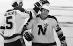 Brad Maxwell congratulated defense partner Gary Sargent after a North Stars goal during a game in 1978.