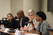 Hennepin County Attorney Mary Moriarty listened as U.S. Rep. Ilhan Omar, right, spoke during a community discussion on the impacts of marijuana legali