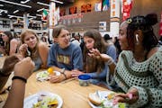 Sophomores Lucy Jarman, from left, Annika Lara-Walen, Maggie Osgood and Taylor Scott talk during lunch on the first day of school at South High School